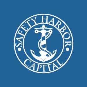 A white logo of the safety harbor capital.